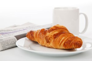 croissant-newspaper-and-tea